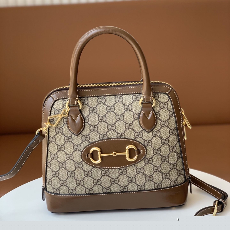 G*u*i top handle bags